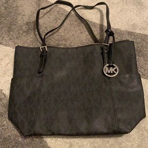 Black and silver gently used Michael Kors purse